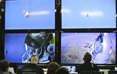 epa03433059 A handout photograph released by Red Bull Stratos on 14 October 2012 showing pilot Felix Baumgartner of Austria seen in a screen at mission control center in the capsule during the final manned flight for Red Bull Stratos in Roswell, New Mexico, USA on 14 October 2012. Reports state that Austrian skydiver Felix Baumgartner is hoping to become the first person to break the sound-barrier without a vehicle. Baumgartner is jumping from a balloon at more than 36.5km above Roswell, New Mexico,USA.  EPA/STEFAN AUFSCHAITER / RED BULL STRATOS / HANDOUT  HANDOUT EDITORIAL USE ONLY/NO SALES