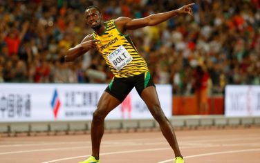 BEIJING, CHINA - AUGUST 23:  Usain Bolt of Jamaica celebrates after winning gold in the Men's 100 metres final during day two of the 15th IAAF World Athletics Championships Beijing 2015 at Beijing National Stadium on August 23, 2015 in Beijing, China.  (Photo by Christian Petersen/Getty Images for IAAF)