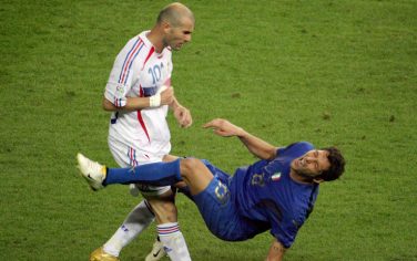 A photo taken 09 July 2006 shows French midfielder Zinedine Zidane (L) gesturing after head-butting Italian defender Marco Materazzi during the World Cup 2006 final football match between Italy and France at Berlin s Olympic Stadium.  AFP PHOTO  JOHN MACDOUGALL (Photo credit should read JOHN MACDOUGALL/AFP/Getty Images)