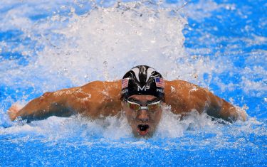 RIO DE JANEIRO, BRAZIL - AUGUST 13:  Michael Phelps of the United States competes in the Men's 4 x 100m Medley Relay Final on Day 8 of the Rio 2016 Olympic Games at the Olympic Aquatics Stadium on August 13, 2016 in Rio de Janeiro, Brazil.  (Photo by Tom Pennington/Getty Images)
