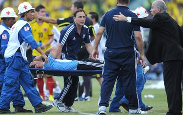 Nicolas Burdisso of Argentina is carried outside of the field on a strecher during a Brazil 2014 World Cup South American qualifier match held at the Metropolitano Roberto Melendez in Barranquilla, on November 15, 2011. (Photo credit should read EITAN ABRAMOVICH/AFP/Getty Images)