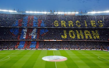 Football supporters hold-up coloured rectangular posters to form a giant mosaic reading, "Thankyou Johan", in tribute to late Dutch football player Johan Cruyff before the Spanish league "Clasico" football match FC Barcelona vs Real Madrid CF at the Camp Nou stadium in Barcelona on April 2, 2016. / AFP / PAU BARRENA        (Photo credit should read PAU BARRENA/AFP/Getty Images)