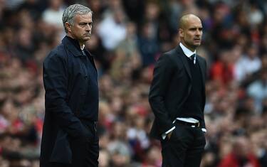 Manchester United's Portuguese manager Jose Mourinho (L) and Manchester City's Spanish manager Pep Guardiola watch from the touchline during the English Premier League football match between Manchester United and Manchester City at Old Trafford in Manchester, north west England, on September 10, 2016. / AFP / Oli SCARFF / RESTRICTED TO EDITORIAL USE. No use with unauthorized audio, video, data, fixture lists, club/league logos or 'live' services. Online in-match use limited to 75 images, no video emulation. No use in betting, games or single club/league/player publications.  /         (Photo credit should read OLI SCARFF/AFP/Getty Images)