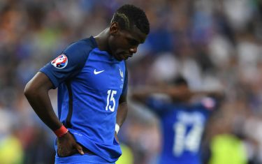 France's midfielder Paul Pogba looks dejected after Portugal won the Euro 2016 final football match between Portugal and France at the Stade de France in Saint-Denis, north of Paris, on July 10, 2016. / AFP / PATRIK STOLLARZ        (Photo credit should read PATRIK STOLLARZ/AFP/Getty Images)