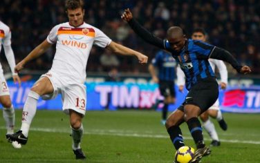Inter Milan forward Samuel Eto'o, of Cameroon, at right, on his way to score, against AS Roma during their Serie A soccer match, at the San Siro stadium in Milan, Italy, Sunday, Nov.8, 2009. At left, AS Roma's Marco Motta.  (AP Photo/Luca Bruno)