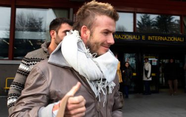 David Beckham arrives at the Malpensa airport, in Busto Arsizio near Milan, Italy,  Monday Dec. 28, 2009.  Beckham will join up with Italian side AC Milan on a six-month loan from LA Galaxy.(AP Photo/Luca Bruno)