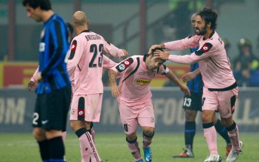 Palermo forward Fabrizio Miccoli, center, celebrates with his teammates after scoring during the Serie A soccer match between Inter Milan and Palermo at the San Siro stadium in Milan, Italy, Thursday, Oct. 29, 2009. (AP Photo/Antonio Calanni)