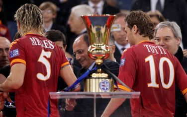 AS Roma's Philippe Mexes of France, left, and Francesco Totti walk past the Italian Cup trophy at the end of the final soccer match between AS Roma and Inter Milan at Rome's Olympic stadium, Wednesday, May 5, 2010. Inter Milan won 1-0. (AP Photo/Andrew Medichini)