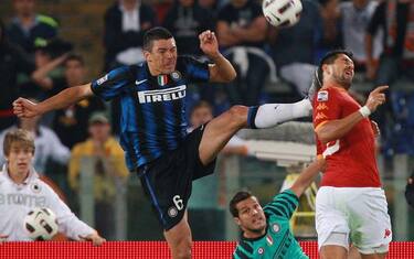 ROME - SEPTEMBER 25:  Lucio of FC Internazionale Milano (L) in action against Marco Borriello of AS Roma during the Serie A match between AS Roma and FC Internazionale Milano at Stadio Olimpico on September 25, 2010 in Rome, Italy.  (Photo by Paolo Bruno/Getty Images) *** Local Caption *** Lucio;Marco Borriello