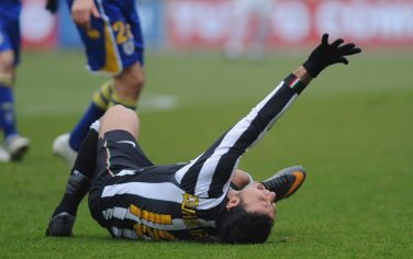 TURIN, ITALY - JANUARY 06:  Fabio Quagliarella of Juventus FC lies injured during the Serie A match between Juventus FC and Parma FC at Olimpico Stadium on January 6, 2011 in Turin, Italy.  (Photo by Valerio Pennicino/Getty Images) *** Local Caption *** Fabio Quagliarella