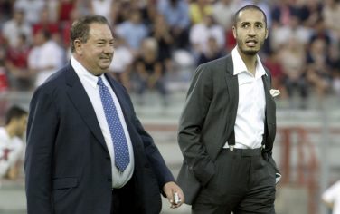 AC Perugia's president Luciano Gaucci (L) arrive together with his Libyan Saadi al Gheddafi (son of the Libyan leader) in the stadium before the Intertoto Cup final first leg match AC Perugia against VfL Wolfsburg 12 August 2003. AFP PHOTO /Vincenzo PINTO  (Photo credit should read VINCENZO PINTO/AFP/Getty Images)