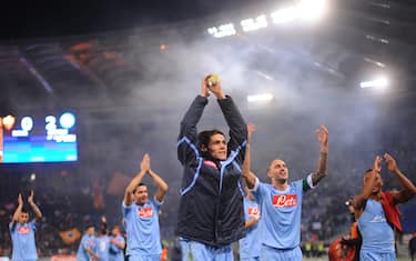 Napoli's Uruguayan forward Edinson Cavani (C) who scored the two goals against AS Roma celebrates with teammates at the end of their Italian serie A football match on February 12, 2011 at the Olympic stadium in Rome. Napoli defeated AS Roma 2-0.   AFP PHOTO / CHRISTOPHE SIMON (Photo credit should read CHRISTOPHE SIMON/AFP/Getty Images)