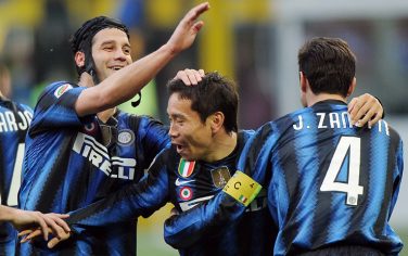 Inter Milan Japaneese defender Yuto Nagatomo (C) celebrates with teammates defenders Christian Chivu (L) and Javier Zanetti after scoring during a Italian Serie A soccer match between Inter Milan and Genoa at the San Siro stadium in Milan, Italy, 6 March 2011.ANSA/DANIEL DAL ZENNARO 