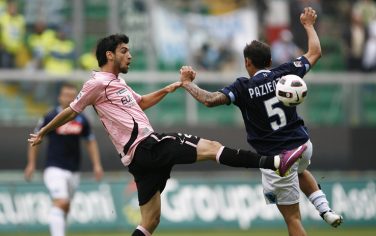 Palermo's Argentinian midfielder Javier Pastore (L) fights for the ball with Napoli's defender Michele Pazienza (R) during their football match at Barbera Stadium on April 23, 2011. AFP PHOTO / Marcello PATERNOSTRO . (Photo credit should read MARCELLO PATERNOSTRO/AFP/Getty Images)