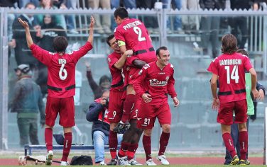 LIVORNO, ITALY - OCTOBER 30: Livorno players celebrate a goal scored by Ahmed Barusso during the Serie B match between Livorno and Reggina at Armando Picchi Stadium on October 30, 2010 in Livorno, Italy.  (Photo by Gabriele Maltinti/Getty Images)