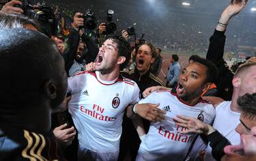 AC Milan's Brazilian forwards Pato (L) and Robinho celebrate after their Italian Serie A football match against AS Roma in Rome's Olympic Stadium on May 7, 2011. AC Milan claimed an 18th Serie A title following a 0-0 draw at Roma on Saturday that gave them an unassailable lead at the top of the table with two games to go. AFP PHOTO / ALBERTO PIZZOLI (Photo credit should read ALBERTO PIZZOLI/AFP/Getty Images)