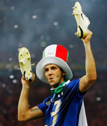 BERLIN - JULY 09:  Marco Materazzi of Italy holds his boots aloft following his team's victory in a penalty shootout at the end of the FIFA World Cup Germany 2006 Final match between Italy and France at the Olympic Stadium on July 9, 2006 in Berlin, Germany.  (Photo by Shaun Botterill/Getty Images)