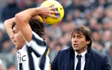 Juventus' coach Antonio Conte (R) reacts during the Italian serie A football match between Juventus and Cagliari at the Juventus Stadium in Turin on January 15, 2012.  AFP PHOTO / FABIO MUZZI (Photo credit should read FABIO MUZZI/AFP/Getty Images)