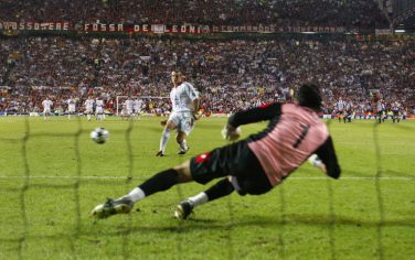 MANCHESTER, ENGLAND - MAY 28:  Andriy Shevchenko of Milan scores the winning goal from the penalty shoot out against Juventus FC goalkeeper Gianluigi Buffon during the UEFA Champions League Final match between Juventus FC and AC Milan on May 28, 2003 at Old Trafford in Manchester, England.  (Photo by Laurence Griffiths/Getty Images)