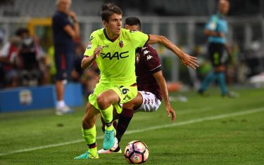 TURIN, ITALY - AUGUST 28:  Adam Nagy (L) of Bologna FC in action against Iago Falque of FC Torino during the Serie A match between FC Torino and Bologna FC at Stadio Olimpico di Torino on August 28, 2016 in Turin, Italy.  (Photo by Valerio Pennicino/Getty Images)