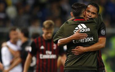 AC Milan's Colombian forward Carlos Bacca (R) celebrates with AC Milan's forward Giacomo Lapadula at the end of the Italian Serie A football match between Sampdoria and AC Milan on September 16, 2016 at 'Luigi Ferraris Stadium' in Genoa. / AFP / MARCO BERTORELLO (Photo credit should read MARCO BERTORELLO/AFP/Getty Images)
