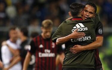 AC Milan's Colombian forward Carlos Bacca (R) celebrates with AC Milan's forward Giacomo Lapadula at the end of the Italian Serie A football match between Sampdoria and AC Milan on September 16, 2016 at 'Luigi Ferraris Stadium' in Genoa.  / AFP / MARCO BERTORELLO        (Photo credit should read MARCO BERTORELLO/AFP/Getty Images)