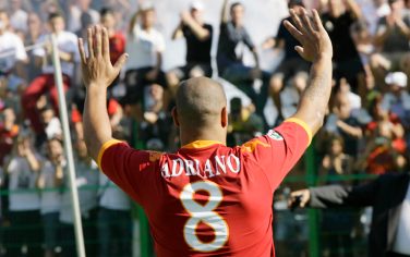 Brazilian soccer ace Adriano waves to fans during the official presentation at the Flaminio stadium in Rome Wednesday, June 9, 2010. Adriano signed a three-year contract with AS Roma. (AP Photo/Alberto Pellaschiar)