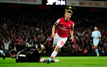 Arsenal's Russian midfielder Andrey Arshavin (C) celebrates scoring the third goal during the League Cup third round football match against Coventry City at the Emirates Stadium in London on September 26, 2012. AFP PHOTO/GLYN KIRKRESTRICTED TO EDITORIAL USE. No use with unauthorized audio, video, data, fixture lists, club/league logos or â??liveâ?  services. Online in-match use limited to 45 images, no video emulation. No use in betting, games or single club/league/player publications.        (Photo credit should read GLYN KIRK/AFP/GettyImages)