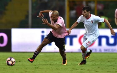 PALERMO, ITALY - AUGUST 12: Stefano Sabelli (R) of Bari holds onto the shirt of Haitam Aleesami of Palermo during the Coppa Italia -  Tim Cup match between US Citta' di Palermo and AS Bari at Stadio Renzo Barbera on August 12, 2016 in Palermo, Italy.  (Photo by Tullio M. Puglia/Getty Images)