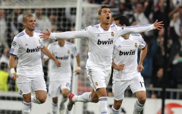 Real Madrid's Portuguese forward Cristiano Ronaldo (C) and teamates react after scoring during their UEFA Champions League Group G football match against Milan on October 19, 2010 at the Bernabeu stadium in Madrid.  AFP PHOTO/ DOMINIQUE FAGET (Photo credit should read DOMINIQUE FAGET/AFP/Getty Images)