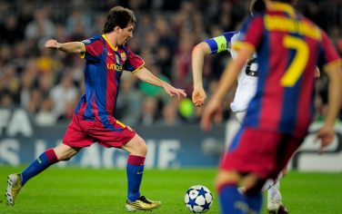 Barcelona's Argentinian forward Lionel Messi (L) scores against Copenhagen's during their UEFA Champions League football match against Copenhagen at the Camp Nou stadium in Barcelona on October 20, 2010.  AFP PHOTO / JOSEP LAGO (Photo credit should read JOSEP LAGO/AFP/Getty Images)