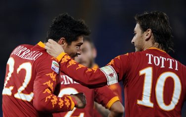 AS Roma's forward Marco Borriello (L) celebrates with his team-mate Francesco Totti (R) after scoring against Fiorentina during their Italian Serie A football match in Rome's Olympic Stadium on November 10, 2010.  AFP PHOTO / Filippo MONTEFORTE (Photo credit should read FILIPPO MONTEFORTE/AFP/Getty Images)