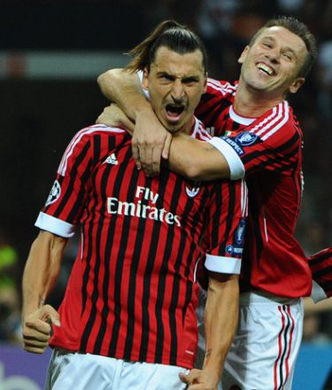 AC Milan's Swedish forward Zlatan Ibrahimovic (L) celebrates with team mate forward Antonio Cassano after scoring a penalty shot against Viktoria Plzen during their Champions League matchday 2 , Group D match on September 28, 2011 at San Siro Stadium In Milan. AFP PHOTO / OLIVIER MORIN (Photo credit should read OLIVIER MORIN/AFP/Getty Images)