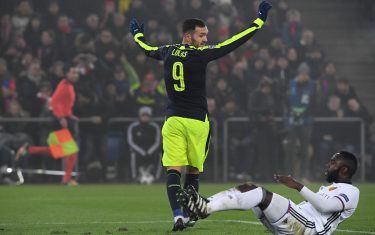 Arsenal's Spanish forward Lucas Perez (C) celebrates after scoring a goal as Basel's Colombian defender Eder Balanta reacts (R) during the UEFA Champions league Group A football match between FC Basel 1893 and Arsenal FC on December 6, 2016 at the St Jakob Park stadium in Basel. / AFP / Patrick HERTZOG        (Photo credit should read PATRICK HERTZOG/AFP/Getty Images)