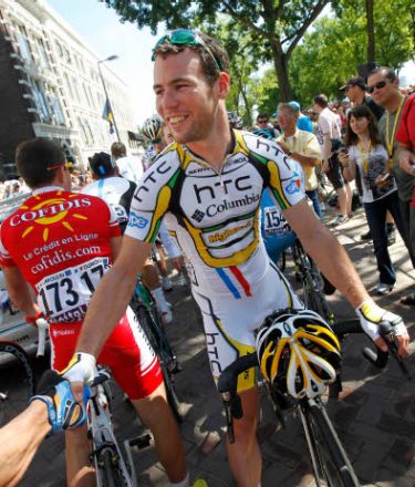 Sprinter Mark Cavendish of Britain is greeted prior to the start of the first stage of the Tour de France cycling race over 223,5 kilometers (139 miles) with start in Rotterdam, Netherlands and finish in Brussels, Belgium, Sunday July 4, 2010.  (AP Photo/Bas Czerwinski)