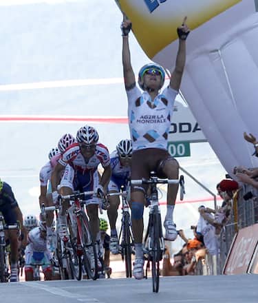 AG2R - La Mondiale's rider John Gadret of France (R) celebrates as he crosses the finish line in first place to win stage 11 of the 94th Tour of Italy cycling race from Tortoreto Lido to Castelfidardo on May 18, 2011.  AFP PHOTO / LUK BENIES (Photo credit should read LUK BENIES/AFP/Getty Images)