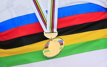 A close up shows the gold medal of Portugal's Alberto Rui Costa on the podium of the elite men's road race UCI World Championship on September 29, 2013 in Florence. Portugal's Alberto Rui Costa stunned Spanish rival Joaquin Rodriguez to win the elite men's road race at the world cycling championships today. Rodriguez finished second to take the silver with compatriot Alejandro Valverde taking bronze at the end of an epic, rain-hit 272.2 km race that claimed several pre-race favourites as well as the entire British team.  AFP PHOTO / LUK BENIES        (Photo credit should read LUK BENIES/AFP/Getty Images)