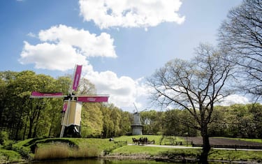 epa05288416 The old Standerdmolen windmill is decorated with pink sails to promote the Giro d'Italia cyling race at the museum park in Arnhem, Netherlands, 03 May 2016. The 99th edition of the Giro d'Italia will start in Apeldoorn on 06 May 2016.  EPA/ROBIN VAN LONKHUIJSEN