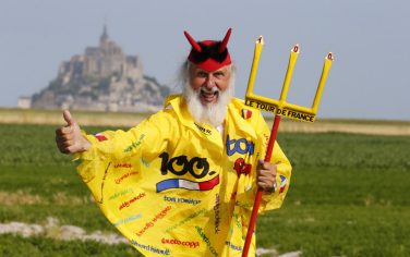 German fan Didi Senft known as El Diablo poses on July 10, 2013 in front of the Mont-Saint-Michel, before the start of the 33 km individual time-trial and eleventh stage of the 100th edition of the Tour de France cycling race between Avranches and Mont-Saint-Michel, northwestern France.  AFP PHOTO / JOEL SAGET        (Photo credit should read JOEL SAGET/AFP/Getty Images)