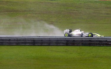 Brawn GP's driver Rubens Barrichello, of Brazil, steers his car during the third training session ahead of Sunday's Brazilian F1 Grand Prix, on the Interlagos racetrack in Sao Paulo, Saturday, Oct. 17, 2009. (AP Photo/Luca Bruno)