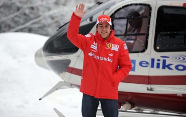 In this photo released by Wrooom2010-Photoservice,  Monday Jan. 11, 2010, new Ferrari Formula 1 driver Fernando Alonso waves as he arrives in Madonna Di Campiglio ski resort in northern Italy, Monday Jan. 11, 2010. The Ferrari and the Ducati racing teams are jointly meeting the media in this mountain resort of the Dolomites. (AP Photo/Wrooom2010-photoservice, HO) ** EDITORIAL USE ONLY **