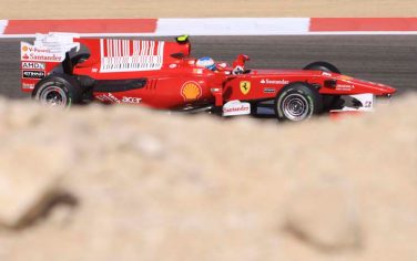 Ferrari driver Fernando Alonso of Spain steers his car during the second training session at the Formula One Bahrain International Circuit in Sakhir, Bahrain, Friday, March 12, 2010. (AP Photo/Hasan Jamali)