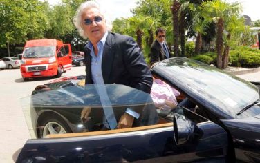 Renault boss Flavio Briatore arrives for a FOTA (Formula One Team's Association) meeting in Bologna, Italy, Thursday, June 25, 2009. The Formula One Team's Association has promised to make farther savings following the peace agreement made on Wednesday with the sport's ruling body FIA. "(Costs will be) significantly lower," Red Bull's Christian Horner told reporters on Thursday. "Already the savings have resulted in 15-25 per cent saved and we will see further savings in the next few seasons." FOTA and the FIA reached an accord at a meeting in Paris on Wednesday after the team's association had threatened to form a breakaway competition. (AP Photo/Gianfilippo Oggioni)