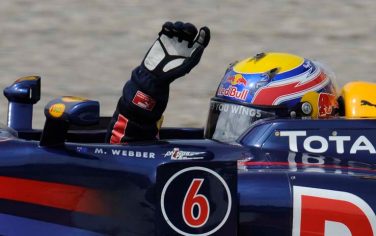 Red Bull Formula One driver Mark Webber of Australia, waves after winning the Spanish Grand Prix at the Montmelo racetrack near Barcelona, Spain, Sunday May 9, 2010. (AP Photo/Alvaro Barrientos)