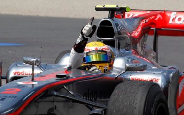 McLaren Mercedes driver Lewis Hamilton of Britain raises his finger to celebrate his Formula One victory  Sunday June 13, 2010 at the Canadian Grand Prix in Montreal. (AP Photo/The Canadian Press,Jacques Boissinot)