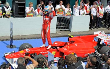Ferrari Formula One driver Fernando Alonso of Spain celebrates after winning the German Formula One Grand Prix in Hockenheim, Germany, Sunday, July 25, 2010. (AP Photo/Jens Meyer)
