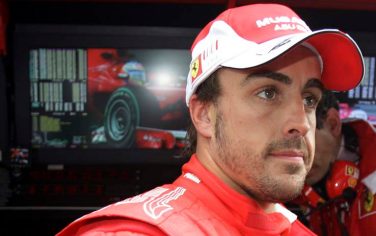 Ferrari driver Fernando Alonso of Spain looks on in the pit after the second free practice ahead the Belgium Formula One Grand Prix in Spa-Franchorchamps circuit , Belgium, Friday, Aug.27 2010 . The Formula one race will be held on Sunday. (AP Photo/Luca Bruno)