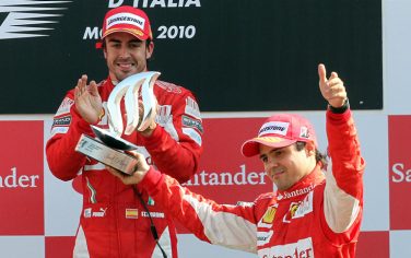 Ferrari's driver Fernando Alonso (L)  of Spain and Felipe Massa of Brasil jubilate on the podium of  the italian F1 Grand Pirx at the Monza circuit, 12 september 2010.
MATTEO BAZZI