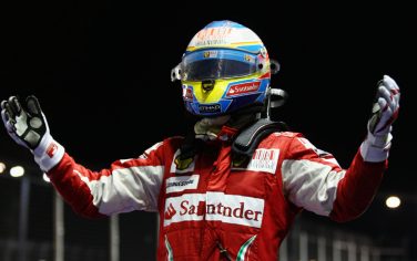 SINGAPORE - SEPTEMBER 26:  Fernando Alonso of Spain and Ferrari celebrates in parc ferme after winning the Singapore Formula One Grand Prix at the Marina Bay Street Circuit on September 26, 2010 in Singapore.  (Photo by Paul Gilham/Getty Images) *** Local Caption *** Fernando Alonso