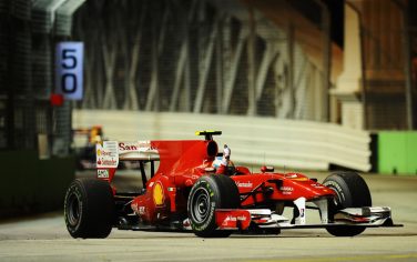 SINGAPORE - SEPTEMBER 26:  Fernando Alonso of Spain and Ferrari celebrates after winning the Singapore Formula One Grand Prix at the Marina Bay Street Circuit on September 26, 2010 in Singapore.  (Photo by Clive Mason/Getty Images) *** Local Caption *** Fernando Alonso